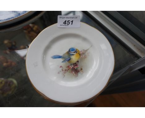 Three Royal Worcester hand painted cabinet plates each depicting birds to include blue tit, great tit, and a red stark.