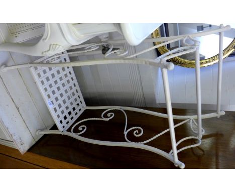 A modern light painted metal shabby chic towel rail.