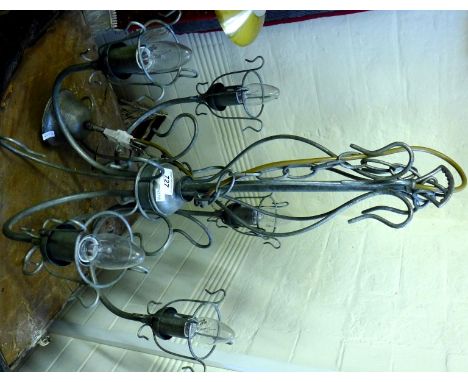 A modern brushed stainless steel industrial style five branch chandelier. 