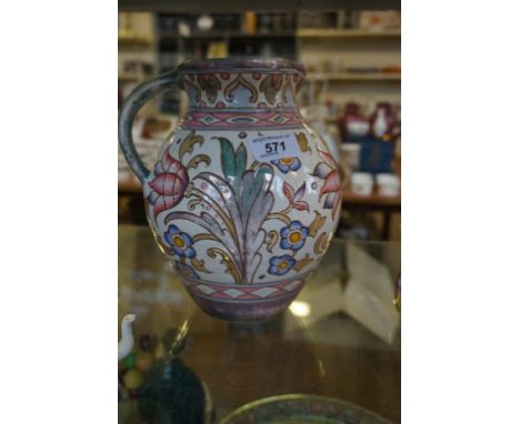 A Bursleyware Charlotte Rhead jug having floral decoration. CONDITION REPORT: Stamped Bursley ware Charlotte Rhead, wear to c