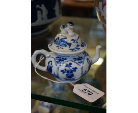A Chinese porcelain blue and white glazed teapot, 18th/19th Century, of small circular rounded form, surmounted by a domed an