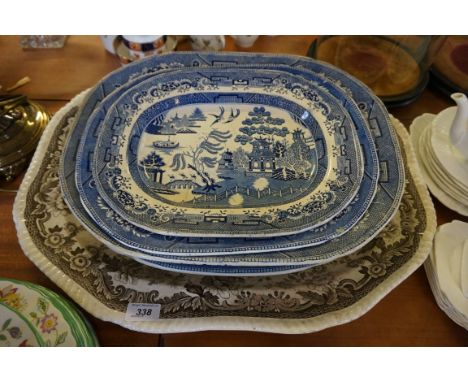 Five assorted 19th Century meat plates to include Willow pattern examples.