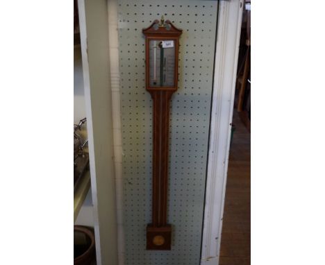 A reproduction Edwardian style stick barometer.