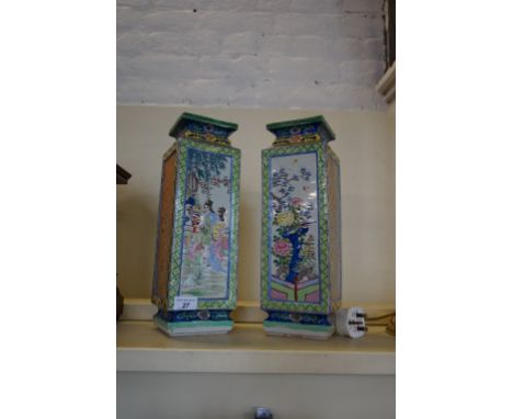 A pair of Chinese famille rose vases of rectangular form. CONDITION REPORT: One with a small flat chip to foot rim, bottom co