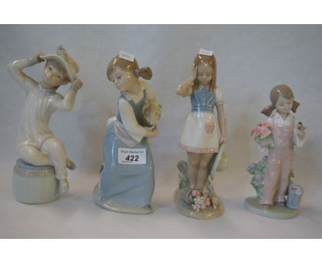 Four assorted Lladro figures.