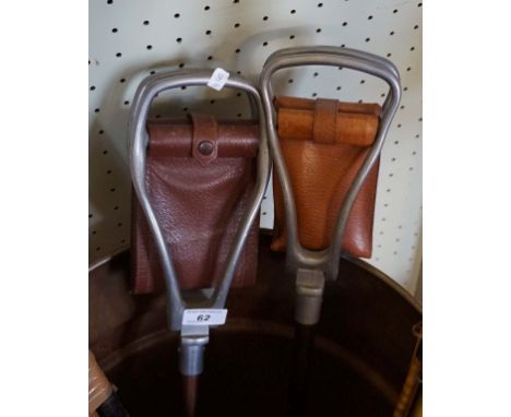 Two vintage shooting stick seats.
