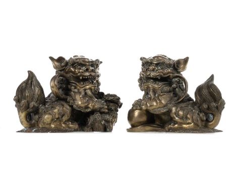 OPPOSING PAIR OF CHINESE POLISHED BRONZE FO DOGS LATE 19TH / EARLY 20TH CENTURY well cast, unmarked15cm high, 18cm longWould 