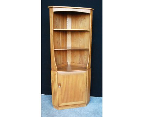 Ercol Golden Dawn corner cabinet with open shelves above single cupboard.