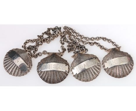 Set of four heavy silver decanter labels of cast scallop form, engraved for Brandy, Port, Whisky and Sherry, by Chatterleys, 