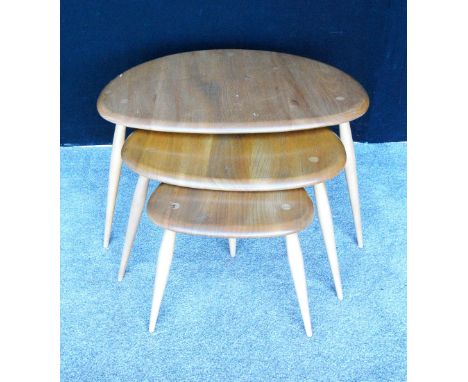 Ercol Golden Dawn beech and elm nest of three pebble tables.