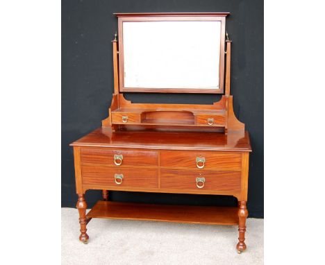 Mahogany dressing table, the rectangular swing mirror over open shelves and two short drawers, with moulded rectangular top, 