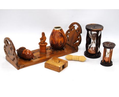 Collection of treen and other items comprising an egg timer, book stand, needle case, seal etc.   (8)