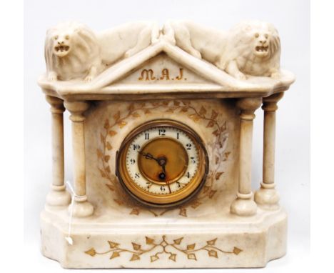 Marble mantel clock, the architectural pediment surmounted by two lions, the circular dial flanked by columns.