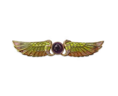 An Egyptian Revival tourmaline and enamel brooch, circa 1900 centring on a cabochon pink tourmaline, between stylised birds w
