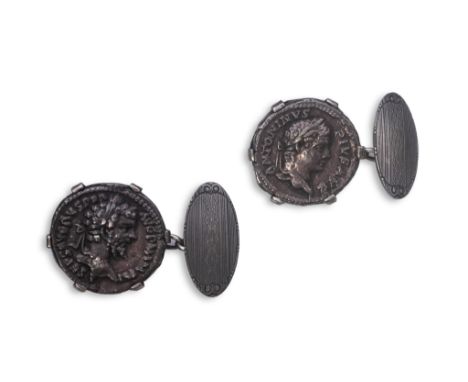 A pair of coin cufflinks, each set with a coin, depicting the emperors Antoninus Pius (r.138-161) and Septimius Severus (AD 1