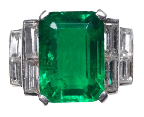 A fine Art Deco emerald and diamond ring, circa 1930 claw-set with a step-cut emerald weighing approximately 2.00 carats, bet
