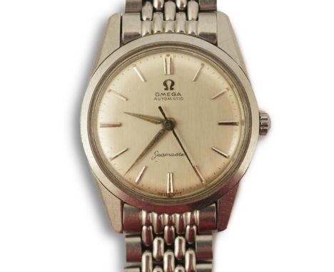 A gentleman's 1960's? stainless steel Omega Seamaster automatic wrist watch, on a stainless steel Omega bracelet, with baton 