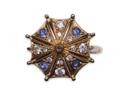 A sapphire and diamond ring, modelled as an open parasol, set with circular-cut sapphires and brilliant-cut diamonds, mounted