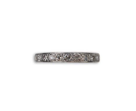 A diamond eternity ring, mid 20th century, set with a continuous band of single-cut diamonds totalling approximately 1.00 car