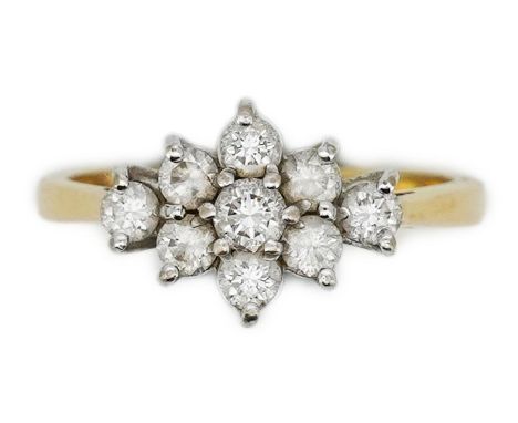 A diamond ring, designed as an elongated cluster of brilliant-cut diamonds, mounted in 18ct gold, size N1/2, British hallmark