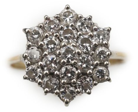 A diamond ring designed as a hexagonal cluster, set with brilliant-cut diamonds, size K1/2, gross weight 3.6 grams.  Overall 