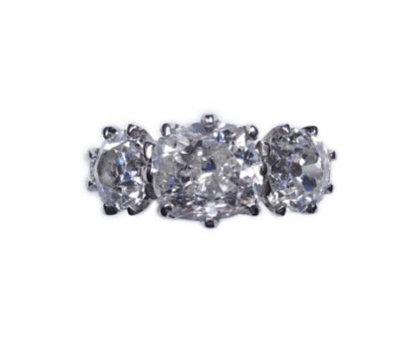 A three-stone diamond ring, claw-set with three antique cushion-shaped diamonds totalling approximately 1.80 carats, size M1/