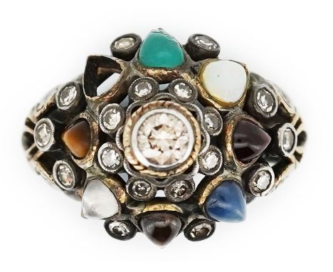 A multi-gem and diamond 'Navaratna' ring, centring on a brilliant-cut diamond within a border of eight pear-shaped cabochon g