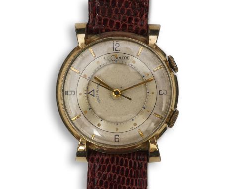 A gentleman's 1950's? 10k gold filled Jaeger LeCoultre Memovox manual wind wrist watch, on a later associated leather strap, 