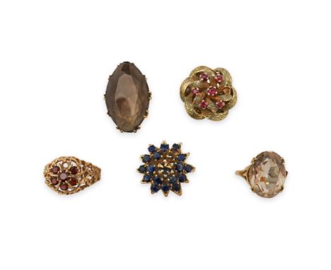 Five gem-set rings, comprising: a ring set with a cluster of circular-cut sapphires, stamped 14K; two set with smoky quartz, 