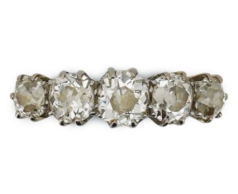 A five-stone diamond ring, early 20th century, set with a sequence of five antique cushion-shaped diamonds totalling approxim