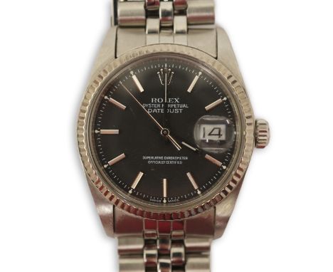 A gentleman's mid 1970's stainless steel Rolex Oyster Perpetual Datejust, on a stainless steel Rolex bracelet, with black dia