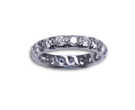 A diamond eternity ring, set with a continuous band of brilliant-cut diamonds totalling approximately 1.40 carats, size M  PL