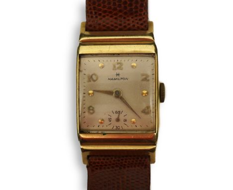 A gentleman's 1950's? 14k gold Hamilton manual wind wrist watch, on a later associated leather strap, with rectangular dial a