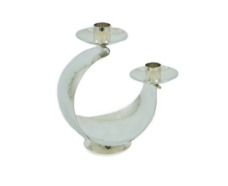 A stylish Elizabeth II planished silver two light candelabrum, by Pruden &amp; Smith, of curved form, with stepped sconces, S