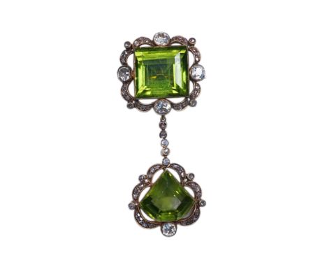 A peridot and diamond brooch, circa 1900 Composed of a step-cut peridot within a foliate border of circular- and rose-cut dia