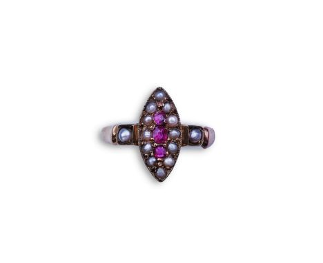 A Victorian ruby and seed pearl ring, circa 1876, of navette outline, set with a vertical line of three cushion-shaped rubies