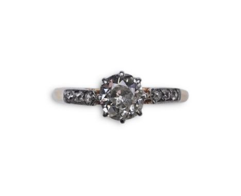 A diamond ring, early 20th century, claw-set with a cushion-shaped diamond weighing approximately 0.40 carats, to shoulders s