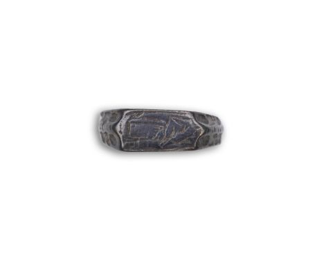 A medieval iconographic ring, England, 14th/15th century the front engraved with a cowled bust of a saint, possibly the Virgi
