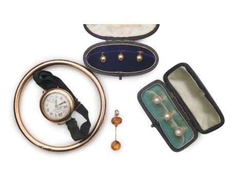 A collection of jewellery, comprising: a gold watch with a black fabric strap, dial signed Archak George Khartoum, case inter