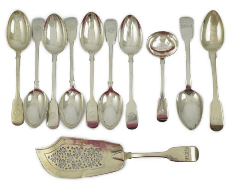 A matched set of seven late Victorian silver table spoons by Goldsmiths &amp; Silversmiths Co Ltd (5) and Francis Higgins (2)