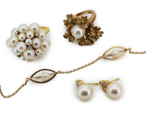 A collection of cultured pearl jewels, comprising: a ring set with a cultured pearl among flowers of textured 9ct gold, size 