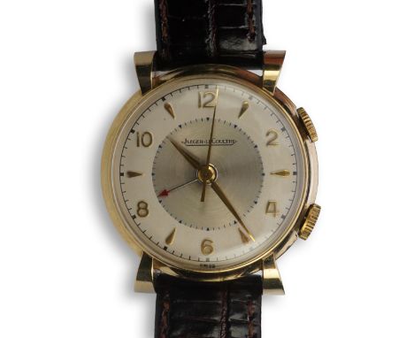 A gentleman's 1950's gold plated Jaeger LeCoultre Memovox manual wind wrist watch, on a later associated leather strap, with 