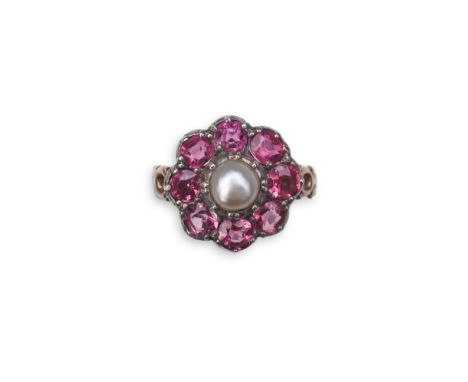 A pearl and pink tourmaline ring, of cluster design, centring on a pearl within a border of circular-cut pink tourmalines, mo