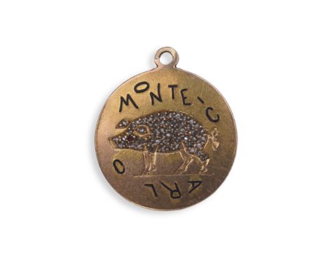 A ruby, enamel and diamond charm pendant, mid 20th century the circular gold disk depicting a pig, set with rose-cut diamonds