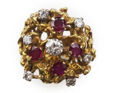 A ruby and diamond cocktail ring, 1970s, of abstract textured design, set with circular-cut diamonds and rubies, size M, gros