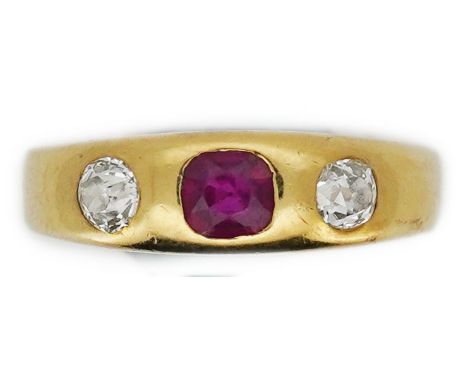 A ruby and diamond three-stone ring, early 20th century, rubover-set with a cushion-shaped ruby between circular-cut diamonds