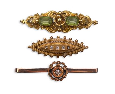 A group of three gem-set brooches, 19th/early 20th century Comprising: a brooch of scrolled design, set with two step-cut per