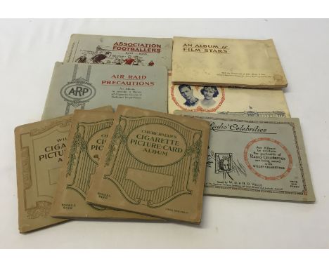 8 albums of cigarette card sets (3 inserted albums to include Christmas Boxing Personalities and Association Footballers.