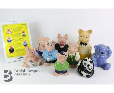 Nine ceramic novelty money boxes, including Natwest pig money boxes, a blue bear and a panda bear.&nbsp;