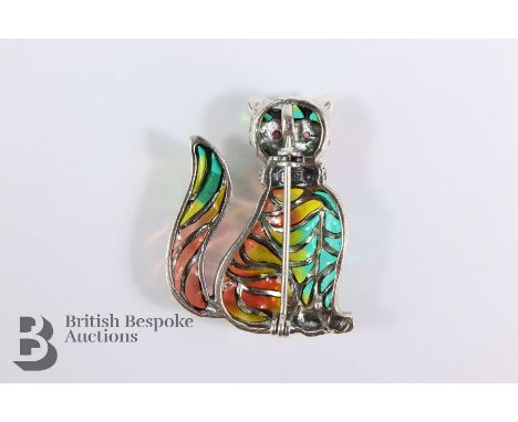 A silver and enamel cat brooch, approx 4 x 3 cms.